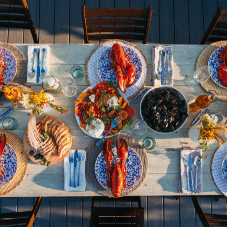 A table with plates of food and glasses

AI-generated content may be incorrect.