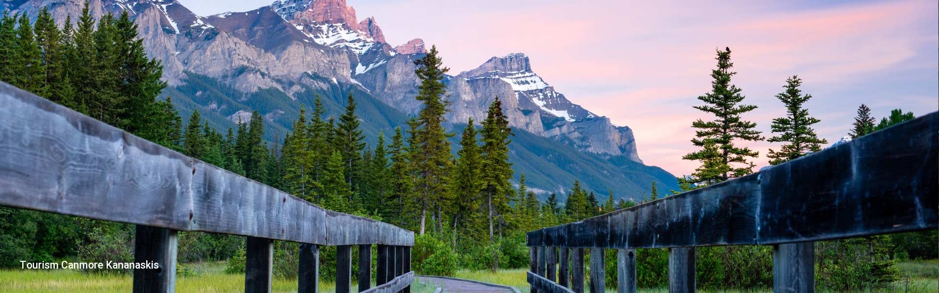 Looking out on the boarwalk with mountain backdrop